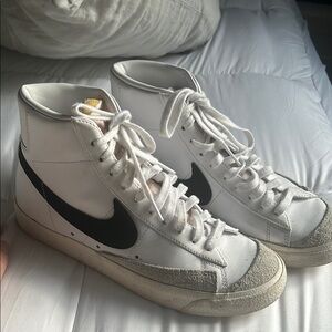 White and Black High-Top Nike blazers